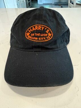 Harry's On The Loop Willow City TX Black Baseball Cap with Orange Embroidery
